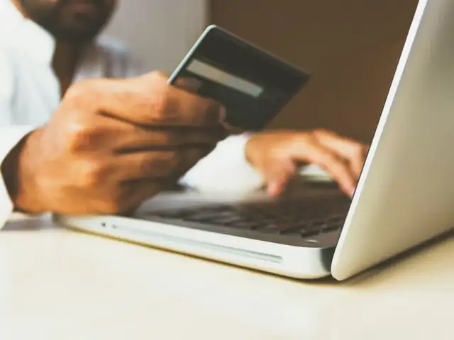 Online payment with a card and laptop