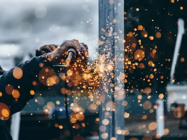 Metal grinding in a manufacturing workshop