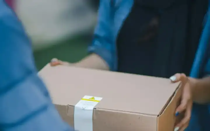 Parcel being handed over at delivery